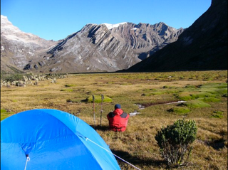 A tourist camps by one of El Cocuy's peaks. Photo taken in 2011.